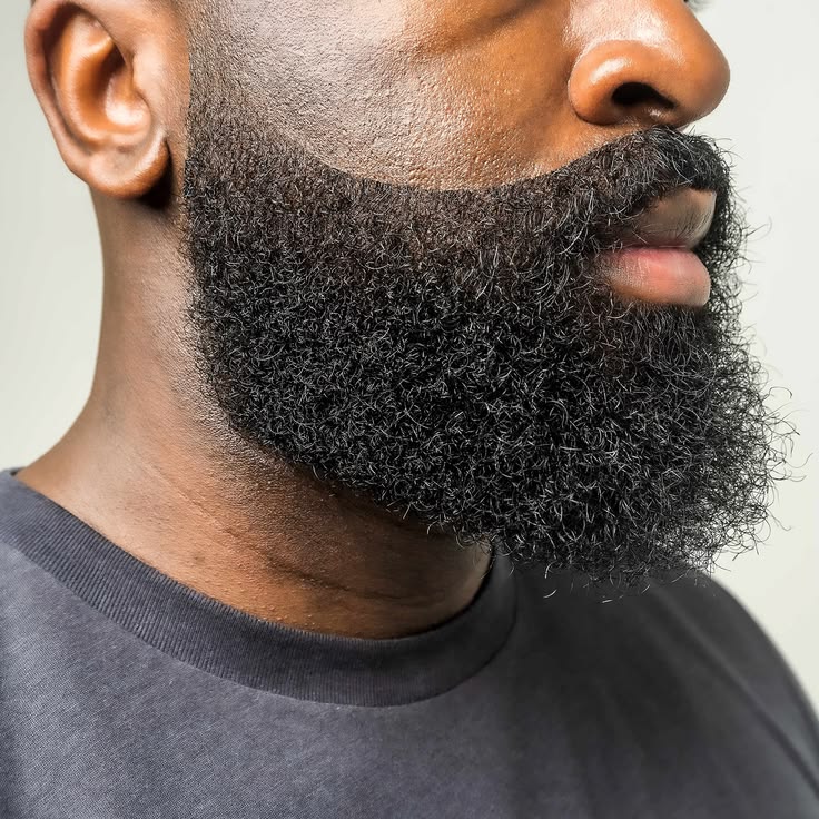 Close-up of a full beard shaped with a clean edge-up
