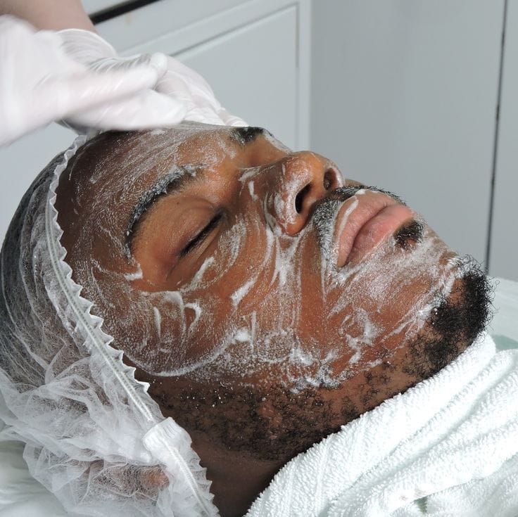 Client receiving a skin scrub and facial refresh